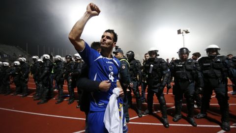 Bosnia's  Emir Spahic celebrates victory during the World Cup group G qualifying soccer match between  Lithuania and Bosnia in Kaunas, Lithuania, Tuesday, Oct. 15, 2013. (AP Photo/Mindaugas Kulbis)