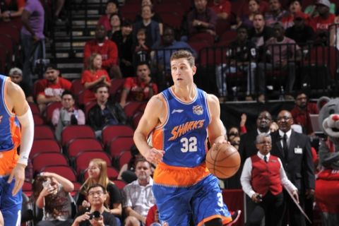 HOUSTON, TX - OCTOBER 2:  Jimmer Fredette #32 of the Shanghai Sharks brings the ball up court against the Houston Rockets during a preseason game on October 2, 2016 at the Toyota Center in Houston, Texas. NOTE TO USER: User expressly acknowledges and agrees that, by downloading and or using this photograph, User is consenting to the terms and conditions of the Getty Images License Agreement. Mandatory Copyright Notice: Copyright 2016 NBAE (Photo by Bill Baptist/NBAE via Getty Images)