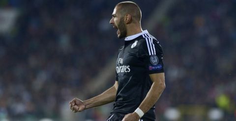 Real Madrid's French forward Karim Benzema celebrates after scoring a goal during the UEFA Champions League Group B football match between Ludogorets Razgrad and Real Madrid at the Vassil Levski stadium in Sofia on October 1, 2014.      AFP PHOTO / NIKOLAY DOYCHINOV        (Photo credit should read NIKOLAY DOYCHINOV/AFP/Getty Images)