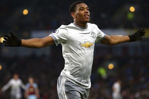 Manchester United's Anthony Martial celebrates scoring his side's first goal of the game during their English Premier League soccer match against Burnley at Turf Moor, Burnley, England, Saturday, Jan. 20, 2018. (Dave Thompson/PA via AP)