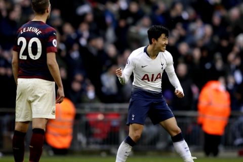 Tottenham's Son Heung-min, right, celebrates after scoring his side's opening goal during the English Premier League soccer match between Tottenham Hotspur and Newcastle at Wembley Stadium in London, Saturday, Feb. 2, 2019. (AP Photo/Tim Ireland)