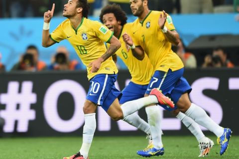 SAO PAULO, BRAZIL - JUNE 12: Neymar of Brazil celebrates scoring a first half goal with Marcelo and Hulk during the 2014 FIFA World Cup Brazil Group A match between Brazil and Croatia at Arena de Sao Paulo on June 12, 2014 in Sao Paulo, Brazil.  (Photo by Buda Mendes/Getty Images)