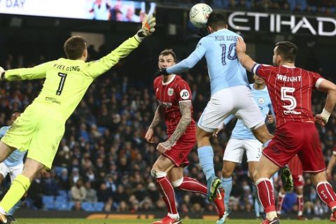 Manchester City's Sergio Aguero scores his sides second goal during the English League Cup semifinal first leg soccer match between Manchester City and Bristol City at the Etihad stadium in Manchester, England, Tuesday, Jan. 9, 2018. (AP Photo/Dave Thompson)