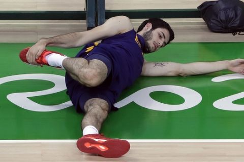 Spain's Alex Abrines stretches during a basketball practice session for the 2016 Summer Olympics in Rio de Janeiro, Brazil, Thursday, Aug. 4, 2016. (AP Photo/Eric Gay)
