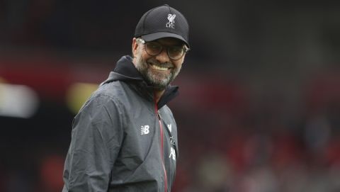 Liverpool's manager Jurgen Klopp smiles during warmup of the English Premier League soccer match between Liverpool and Leicester City in Anfield stadium in Liverpool, England, Saturday, Oct. 5, 2019. (AP Photo/Jon Super)