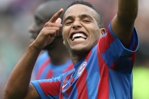Caen's forward Youssef El Arabi of Morocco jubilates at the end of their French Premier League soccer match against Lyon, Sunday, Aug. 15, 2010 in Caen, northwestern France. Caen won 3-2. (AP Photo/David Vincent)