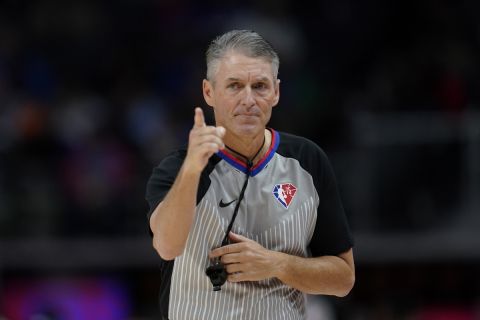 Referee Scott Foster makes a call in the first half of an NBA basketball game between the Detroit Pistons and Memphis Grizzlies in Detroit, Feb. 10, 2022. (AP Photo/Paul Sancya)