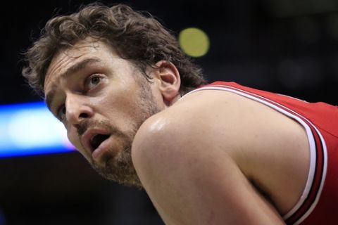 FILE - This is a Sunday, April 3, 2016 file photo of Chicago Bulls center Pau Gasol   looks up as the Milwaukee Bucks take a free throw during the second half of an NBA basketball game, in Milwaukee . Pau Gasol says he is considering not playing at the Olympics because of the Zika virus. The Spanish basketball player says there is too much uncertainty about the situation in Brazil and anyone going to Rio de Janeiro for the games should "think about" whether it's worth the risk. (AP Photo/Darren Hauck, File)