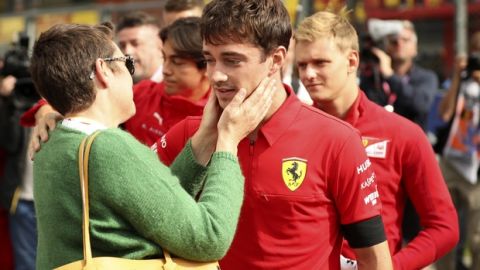 The mother of Anthoine Hubert speaks with Ferrari driver Charles Leclerc of Monaco after a moment of silence for Formula 2 driver Anthoine Hubert at the Belgian Formula One Grand Prix circuit in Spa-Francorchamps, Belgium, Sunday, Sept. 1, 2019. The 22-year-old Hubert died following an estimated 160 mph (257 kph) collision on Lap 2 at the high-speed Spa-Francorchamps track, which earlier Saturday saw qualifying for Sunday's Formula One race. (AP Photo/Francisco Seco)