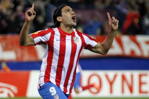 MADRID, SPAIN - APRIL 19:  Radamel Falcao of Atletico Madrid celebrates after scoring the opening goal during the UEFA Europa League Semi Final first leg match between Atletico Madrid and Valencia at Vicente Calderon stadium on April 19, 2012 in Madrid, Spain.  (Photo by Angel Martinez/Getty Images)