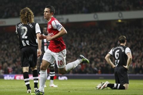 Arsenal's Dutch player Robin van Persie (C) celebrates scoring his goal during an English Premier League football match between Arsenal and Newcastle United at The Emirates Stadium in London , England on March 12, 2012. AFP PHOTO/IAN KINGTON

RESTRICTED TO EDITORIAL USE. No use with unauthorised audio, video, data, fixture lists, club/league logos or âliveâ services. Online in-match use limited to 45 images, no video emulation. No use in betting, games or single club/league/player publications. (Photo credit should read IAN KINGTON/AFP/Getty Images)
