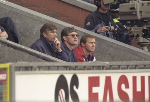 12 Oct 1996:  (left-right) Arsene Wenger the new Arsenal manager watches his first game in charge of his new club from visitors bench, alongside him are assistant manager Pat Rice and physio Gary Lewin  during the FA Carling Premier league match betweenBlackburn Rovers and Arsenal at Ewood Park in Blackburn. Arsenal went onto win the game by 0-2. Mandatory Credit: Shaun Botterill/Allsport