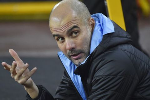 Manchester City's head coach Pep Guardiola, gestures prior to the start of an English Premier League soccer match between Wolverhampton Wanderers and Manchester City at the Molineux Stadium in Wolverhampton, England, Friday, Dec. 27, 2019. (AP Photo/Rui Vieira)