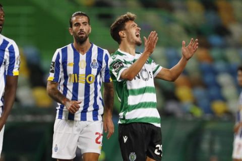 Sporting's Pedro Goncalves, center right, reacts after a missed chance to score during the Portuguese league soccer match between Sporting CP and FC Porto at the Jose Alvalade stadium in Lisbon, Saturday, Oct. 17, 2020. (AP Photo/Armando Franca)