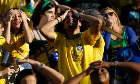Brazil soccer fans react as Belgium scores during a live telecast of the Brazil vs. Belgium World Cup quarter finals soccer match, in Rio de Janeiro, Brazil, Friday, July 6, 2018. (AP Photo/Silvia Izquierdo)