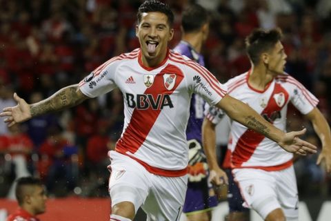 Sebastian Driussi of Argentina's River Plate celebrates scoring his team's second goal against Colombia's Deportivo Independiente Medellin during a Copa Libertadores Group 3 soccer match at the Atanasio Girardot stadium in Medellin, Colombia, Wednesday, March 15, 2017. (AP Photo/Ricardo Mazalan)