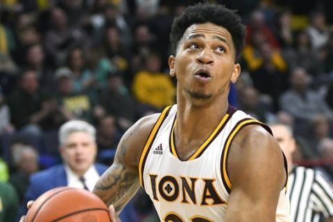 Iona forward Jordan Washington (23) puts up a shot against Siena during the first half of an NCAA college basketball game in the championship of the Metro Atlantic Athletic Conference tournament on Monday, March 6, 2017, in Albany, N.Y. Iona won 87-86. (AP Photo/Hans Pennink)