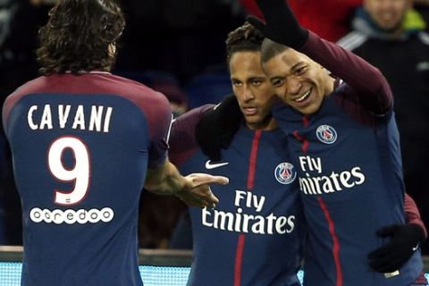 PSG's Neymar, right, celebrates with teammate Edinson Cavani, left, and Kylian Mbappe, right, during his French League One soccer match between Paris-Saint-Germain and Dijon, at the Parc des Princes stadium in Paris, France, Wednesday, Jan.17, 2018. (AP Photo/Thibault Camus)