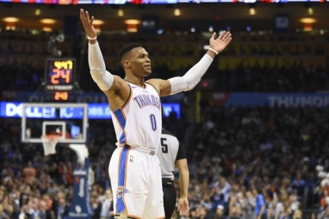 Oklahoma City Thunder guard Russell Westbrook hypes up the crowd in the first half of an NBA basketball game against the Chicago Bulls in Oklahoma City, Monday, Dec. 17, 2018. (AP Photo/Kyle Phillips)