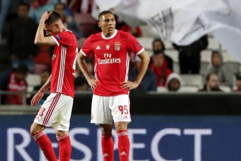 Benfica's Julian Weigl and Carlos Vinicius, right, react at the end of the Europa League round of 32 second leg soccer match between SL Benfica and Shakhtar Donetsk at the Luz stadium in Lisbon, Thursday, Feb. 27, 2020. The game ended in a 3-3 draw with Shakhtar advancing on a 5-4 aggregate result. (AP Photo/Armando Franca)