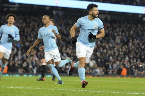 Manchester City's Sergio Aguero, right, celebrates after scoring his side's second goal during the English Premier League soccer match between Manchester City and Newcastle United at the Etihad Stadium in Manchester, England, Saturday, Jan. 20, 2018. (AP Photo/Rui Vieira)