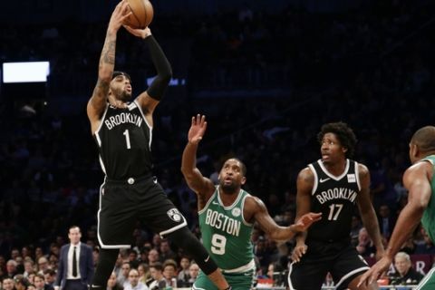 Brooklyn Nets' D'Angelo Russell (1) shoots over Boston Celtics' Brad Wanamaker (9) during the first half of an NBA basketball game Monday, Jan. 14, 2019, in New York. (AP Photo/Frank Franklin II)