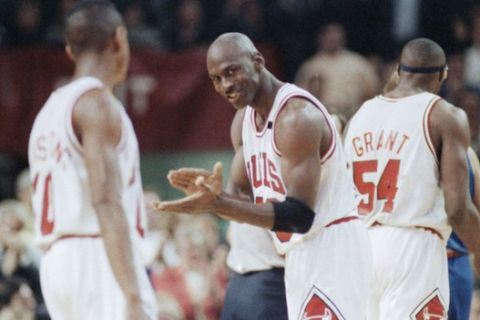 The Chicago Bulls Michael Jordan (23) laughs, with teammate Horace Grant (54) in the background, during the fourth quarter of Game 5 with the Cleveland Cavaliers in the Eastern Conference Final, Wednesday, May 28, 1992, Chicago, Ill. The Bulls beat the Cavs 112-89 to go up 3-2 in the best-of-seven series. (AP Photo/Fred Jewell)