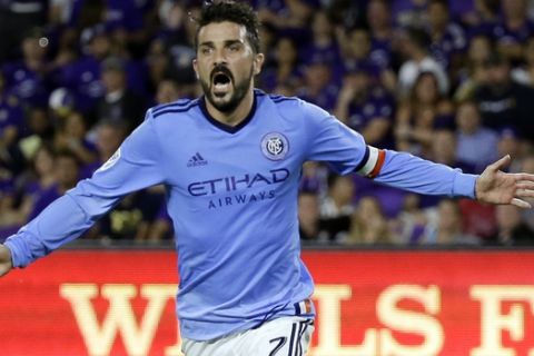 FILE - In this Sunday, May 21, 2017 file photo, New York City FC's David Villa (7) celebrates his second-half goal as he runs past Orlando City's Leo Pereira, left, in an MLS soccer game in Orlando, Fla. Its Rivalry Week for Major League Soccer with three marquee matchups set for this weekend. The Hudson River Derby between the Red Bulls and NYCFC on Saturday, June 24, 2017 has been grabbing much of the attention. (AP Photo/John Raoux, File)