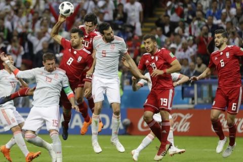 Iran's Morteza Pouraliganji, (8), handles the ball into the net, and the goal was dissallowd after a review by VAR during the group B match between Iran and Spain at the 2018 soccer World Cup in the Kazan Arena in Kazan, Russia, Wednesday, June 20, 2018. (AP Photo/Sergei Grits)