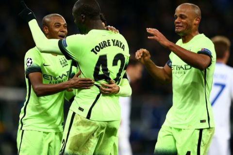 KIEV, UKRAINE - FEBRUARY 24:  (L-R) Fernandinho, Yaya Toure and Vincent Kompany of Manchester City celebrate their team's 3-1 victory as the final whistle blows during the UEFA Champions League round of 16, first leg match between FC Dynamo Kyiv and Manchester City FC at the Olympic Stadium on February 24, 2016 in Kiev, Ukraine.  (Photo by Michael Steele/Getty Images)