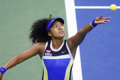 Naomi Osaka, of Japan, serves to Shelby Rogers, of the United States, during the quarterfinal round of the US Open tennis championships, Tuesday, Sept. 8, 2020, in New York. (AP Photo/Frank Franklin II)