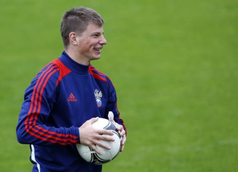 Russia's Andrei Arshavin smiles during a training session of the Russian team at the  Euro 2012 soccer championship in Sulejowek, Poland, Tuesday, June 5, 2012. (AP Photo/Sergey Ponomarev)