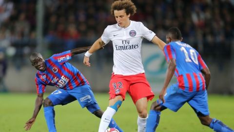 Paris Saint Germain's defender David Luiz of Brazil challenges for the ball with Caen's midfielder Ngolo Kante, left, and Lenny Nangis during his League One soccer match against Caen, in Caen, western France, Wednesday, Sept. 24, 2014. Paris SG won 2-0. (AP Photo/David Vincent)
