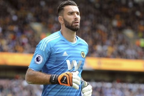 Wolverhampton Wanderers goalkeeper Rui Patricio runs in front of the goal during the English Premier League soccer match between Wolverhampton Wanderers and Manchester City at the Molineux Stadium in Wolverhampton, England, Saturday, Aug. 25, 2018. (AP Photo/Rui Vieira)