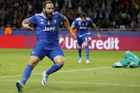 Juventus' Gonzalo Higuain celebrates after scoring during the Champions League semifinal first leg soccer match between Monaco and Juventus at the Louis II stadium in Monaco, Wednesday, May 3, 2017. (AP Photo/Claude Paris)