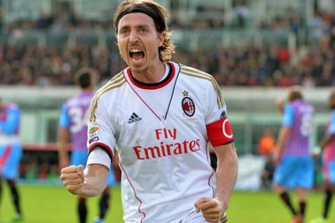 AC Milan midfielder Riccardo Montolivo celebrates after scoring during the Serie A soccer match between Catania and AC Milan at the Angelo Massimino stadium in Catania, Italy, Sunday, Dec. 1, 2013. (AP Photo/Carmelo Imbesi)