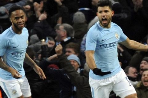 Manchester City's Sergio Aguero, right, celebrates after scoring his side's first goal during the English FA Cup Third Round soccer match between Manchester City and Burnley at Etihad stadium in Manchester, England, Saturday, Jan. 6, 2018. (AP Photo/Rui Vieira)