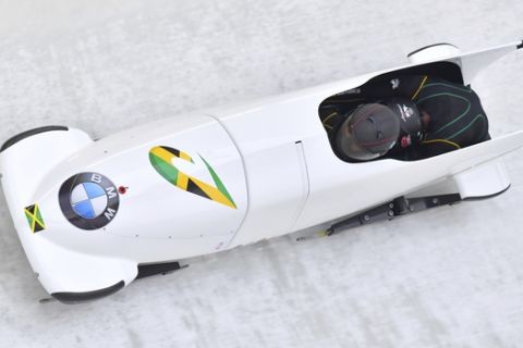 Jazmine Fenlator-Victorian and Carrie Russell of Jamaica speed down the track during their first run of the women's  bobsled World Cup race in Innsbruck, Saturday, Dec. 16, 2017. (AP Photo/Kerstin Joensson)