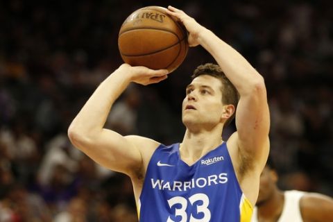 In this photo taken Monday July 1, 2019, Golden State Warriors guard Jimmer Fredette shoots a free throw during the first half of an NBA basketball summer league game against the Sacramento Kings in Sacramento, Calif. The Kings won 81-77. (AP Photo/Rich Pedroncelli)