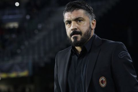 AC Milan coach Gennaro Gattuso arrives at the bench during the Europa League, Group F soccer match between AC Milan and Betis, at the Benito Villamarin Stadium in Seville, Spain, Thursday, Nov. 8, 2018. (AP Photo/Manuel Gomez)