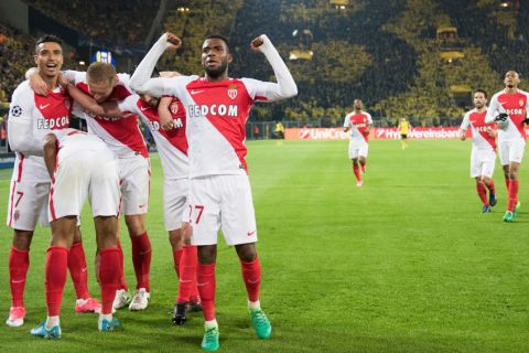 Monaco's players celebrate their side's third goal during the Champions League quarterfinal first leg soccer match between Borussia Dortmund and AS Monaco in Dortmund, Germany, Wednesday, April 12, 2017. Monaco defeated Dortmund by 3-2. (Bernd Thissen/dpa via AP)