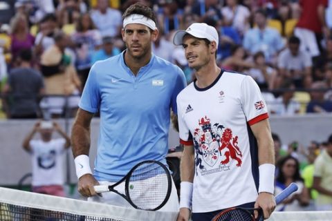 Juan Martin del Potro, of Argentina, left, and Andy Murray, of England, pose at the net prior to their gold medal match at the 2016 Summer Olympics in Rio de Janeiro, Brazil, Sunday, Aug. 14, 2016. (AP Photo/Charles Krupa)