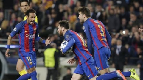 Barcelona's Lionel Messi, center, runs holding the ball after scoring on a penalty, flanked by his teammates Neymar, left and Gerard Pique, during the Champions League round of 16, second leg soccer match between FC Barcelona and Paris Saint Germain at the Camp Nou stadium in Barcelona, Spain, Wednesday March 8, 2017. (AP Photo/Emilio Morenatti)