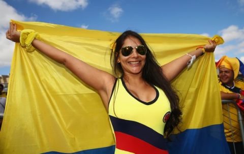 BELO HORIZONTE, BRAZIL - JUNE 14: A Colombia fan holds a flag prior to the 2014 FIFA World Cup Brazil Group C match between Colombia and Greece at Estadio Mineirao on June 14, 2014 in Belo Horizonte, Brazil.  (Photo by Ian Walton/Getty Images)