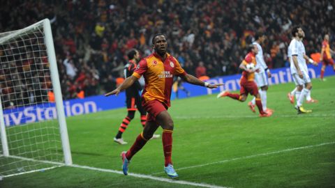 Galatasaray's Ivorian forward Didier Drogba celebrates after his goal during the UEFA Champions League quarter-final second leg football match Galatasaray vs Real Madrid on April 9, 2013 at Ali Sami Yen stadium in Istanbul.   AFP PHOTO / BULENT KILIC        (Photo credit should read BULENT KILIC/AFP/Getty Images)
