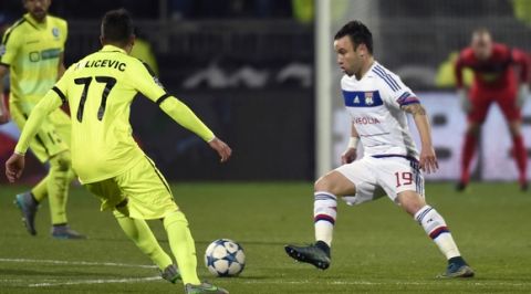 Lyon's French forward Mathieu Valbuena (R) vies for the ball with Gent's Serbian midfielder Danijel Milicevic (L) during the UEFA Champions League group H football match between Lyon and Gent on November 24, 2015 at the Gerland stadium in Lyon, southeastern France. AFP PHOTO / PHILIPPE DESMAZES / AFP / PHILIPPE DESMAZES        (Photo credit should read PHILIPPE DESMAZES/AFP/Getty Images)