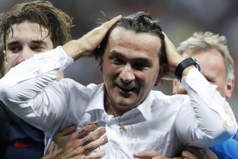 Croatia head coach Zlatko Dalic celebrates after his team advanced to the final during the semifinal match between Croatia and England at the 2018 soccer World Cup in the Luzhniki Stadium in Moscow, Russia, Wednesday, July 11, 2018. (AP Photo/Frank Augstein)