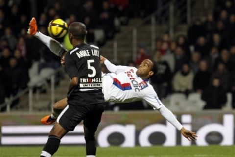 Lyon's Jimmy Briand, right, scores a goal against Nancy during their French League One soccer match in Lyon, central France, Friday, Feb. 18, 2011. (AP Photo/Laurent Cipriani)