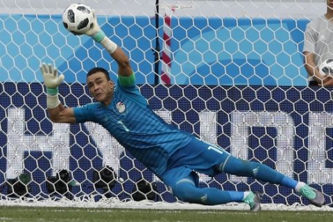 Egypt goalkeeper Essam El Hadary deflects a penalty during the group A match between Saudi Arabia and Egypt at the 2018 soccer World Cup at the Volgograd Arena in Volgograd, Russia, Monday, June 25, 2018. (AP Photo/Darko Vojinovic)