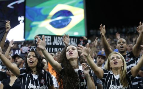 Corinthians soccer fans cheer from the stands during a Brasileirao championship soccer match with Fluminense in Sao Paulo, Brazil, Wednesday, Nov. 15, 2017. (AP Photo/Andre Penner)